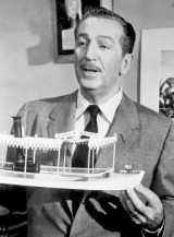 Walt Disney holding model of jungle cruise boat
